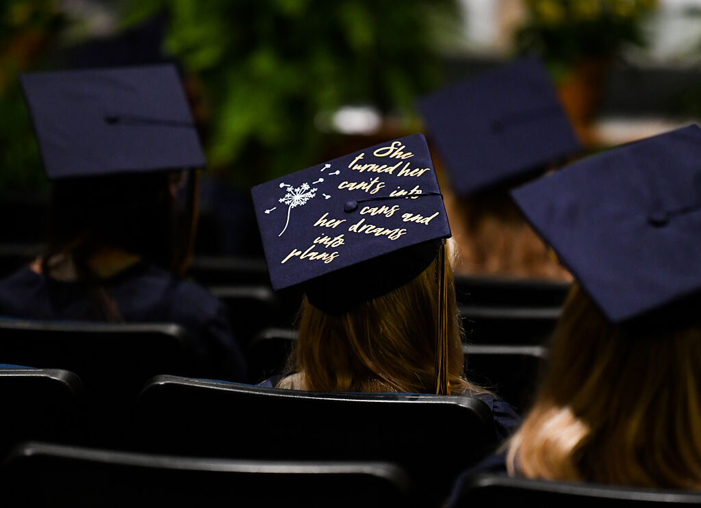 A graduate with a decorated mortarboard